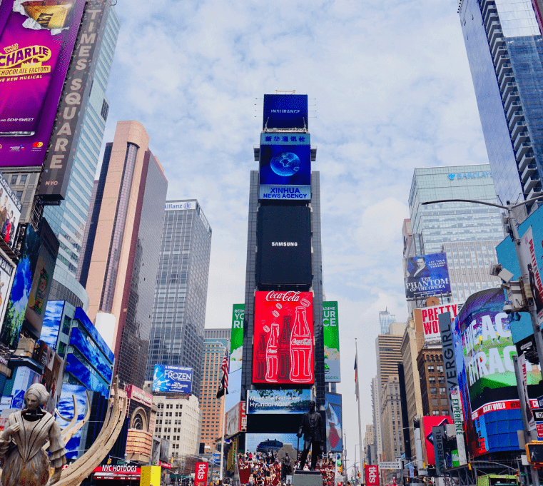 Vibrant Times Square scene with digital billboards and bustling crowds.